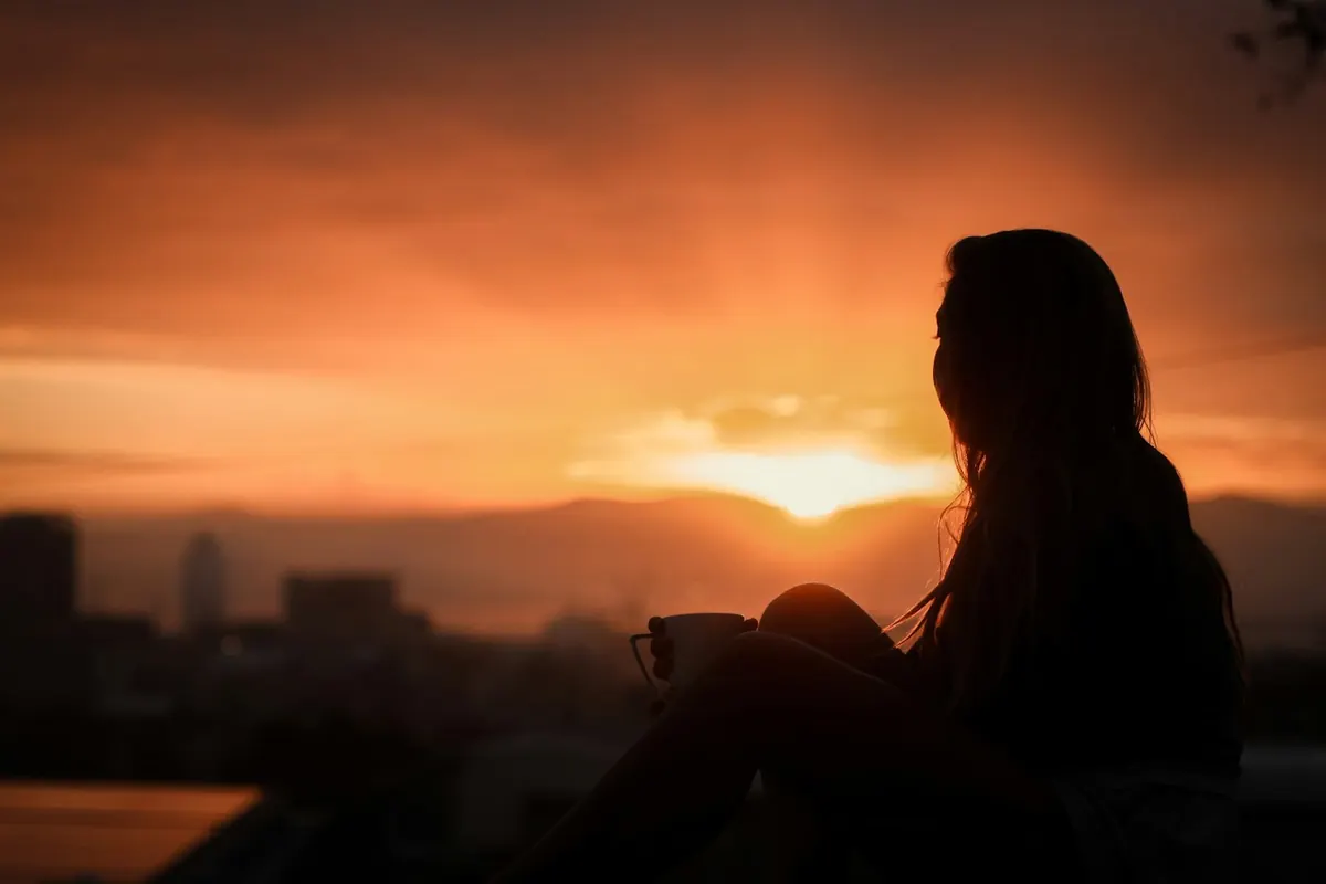 silhouette of woman during sunset